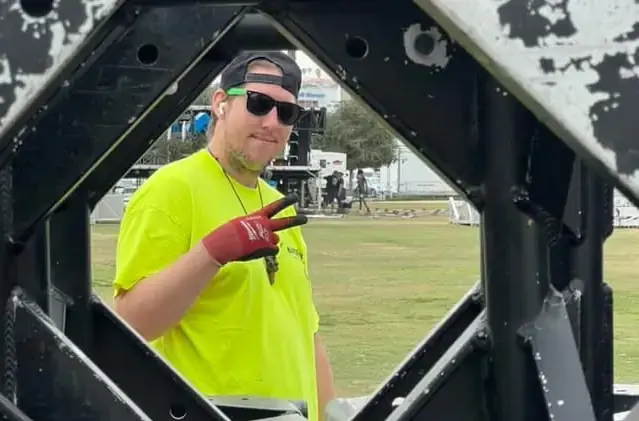 Hands On Labor crew standing together during a major stage build