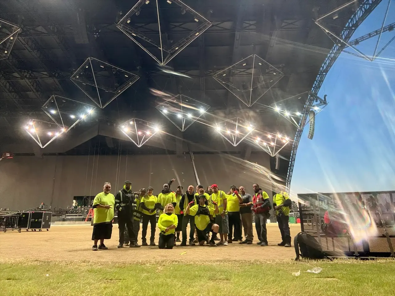 Hands On Labor stagehands, carpenters, and production technicians assembled backstage at a San Diego festival venue