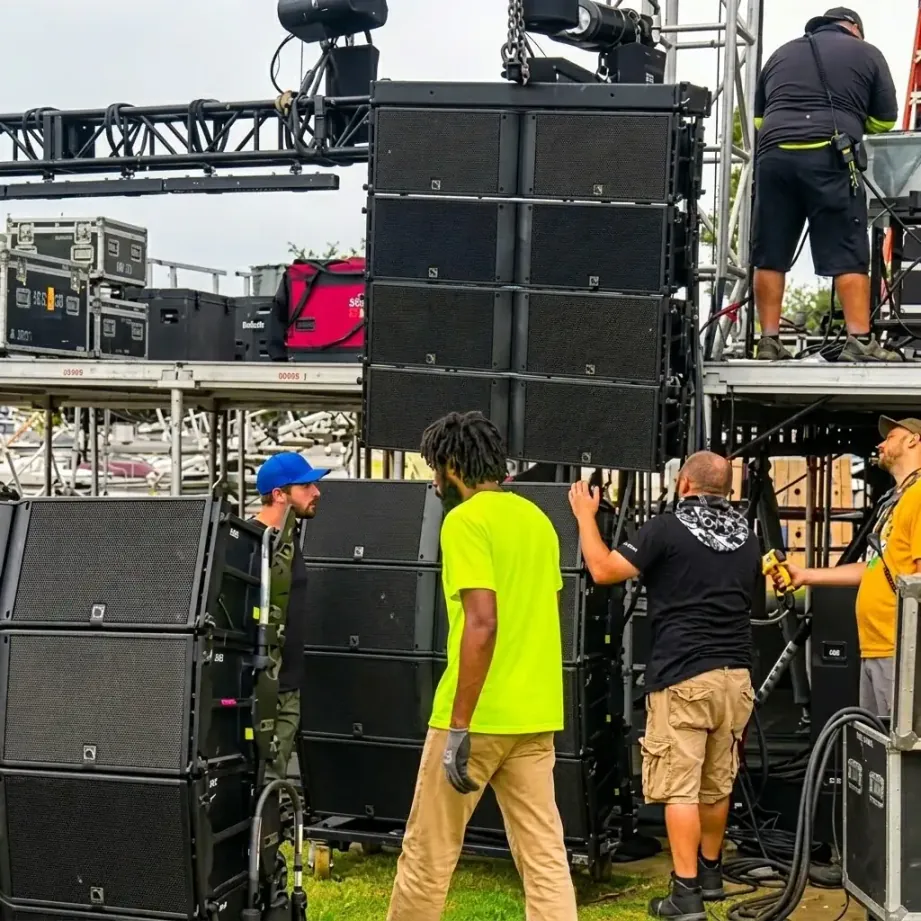 Audio crew loading in sound equipment for an event