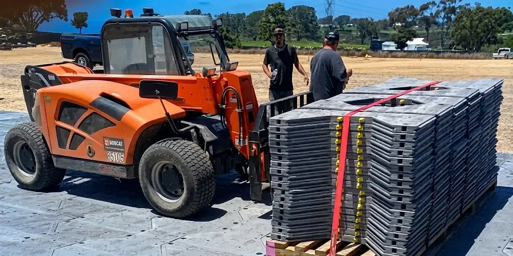 Crew managing facility staging materials and grounds operations