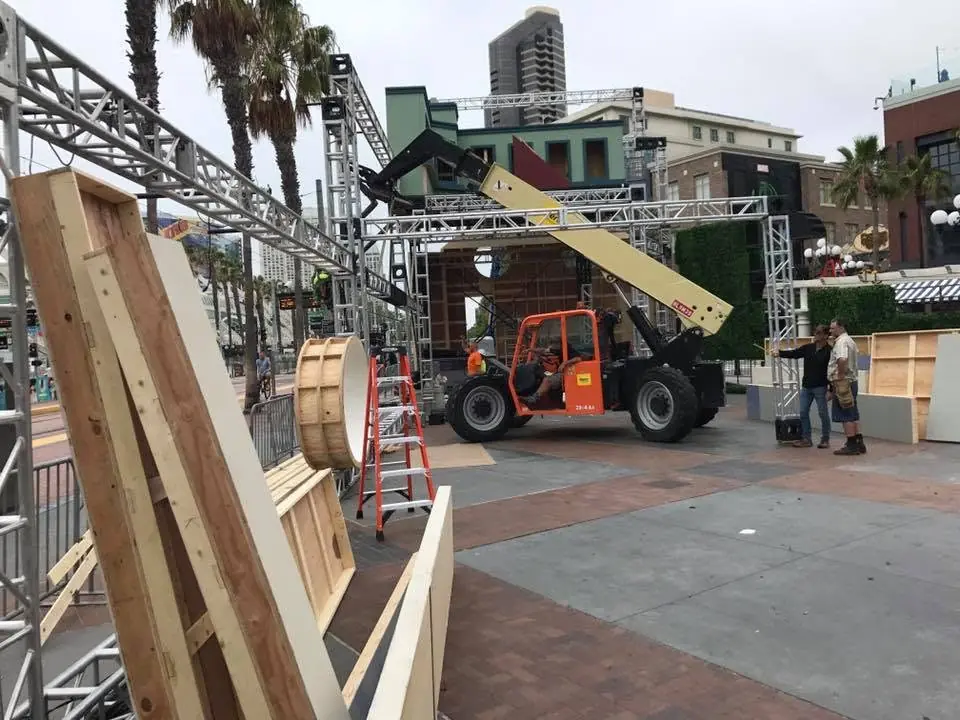 Reach forklift operator navigating high-density pallet racks in narrow warehouse aisles